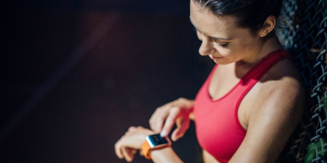 woman using fitness tracker